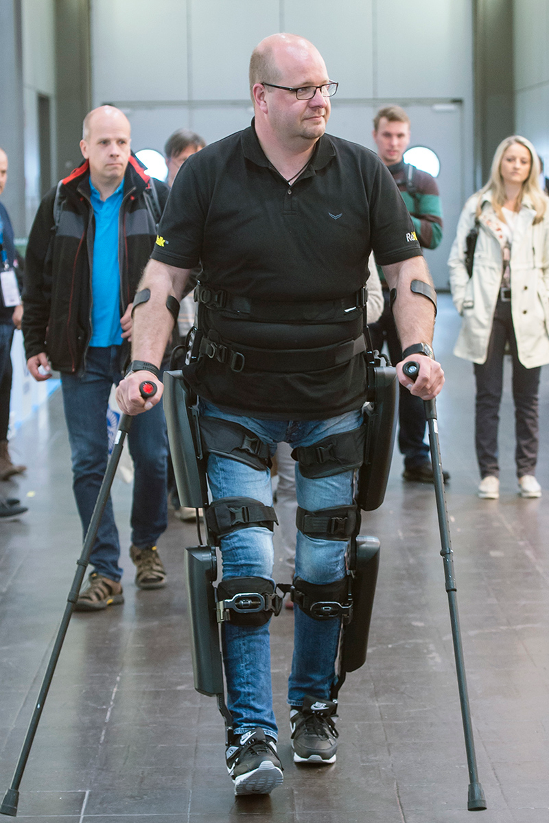 Paraplegic Andre van Rueschen walks with the help of an exoskeleton manufactured by the company ReWalk Robotics. Image: Jens Meyer/AP